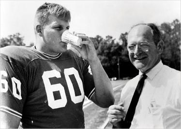 Chip Hinton testing Gatorade 1965, pictured next to the leader of its team of inventors, Robert Cade.